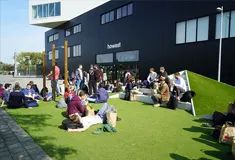 Students sitting outside Howest University of Applied Sciences