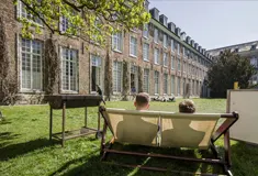 Students sitting in deck chairs outside KU Leuven campus
